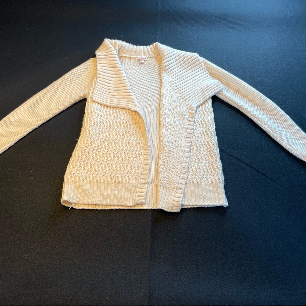 Beige sweater with large collar.